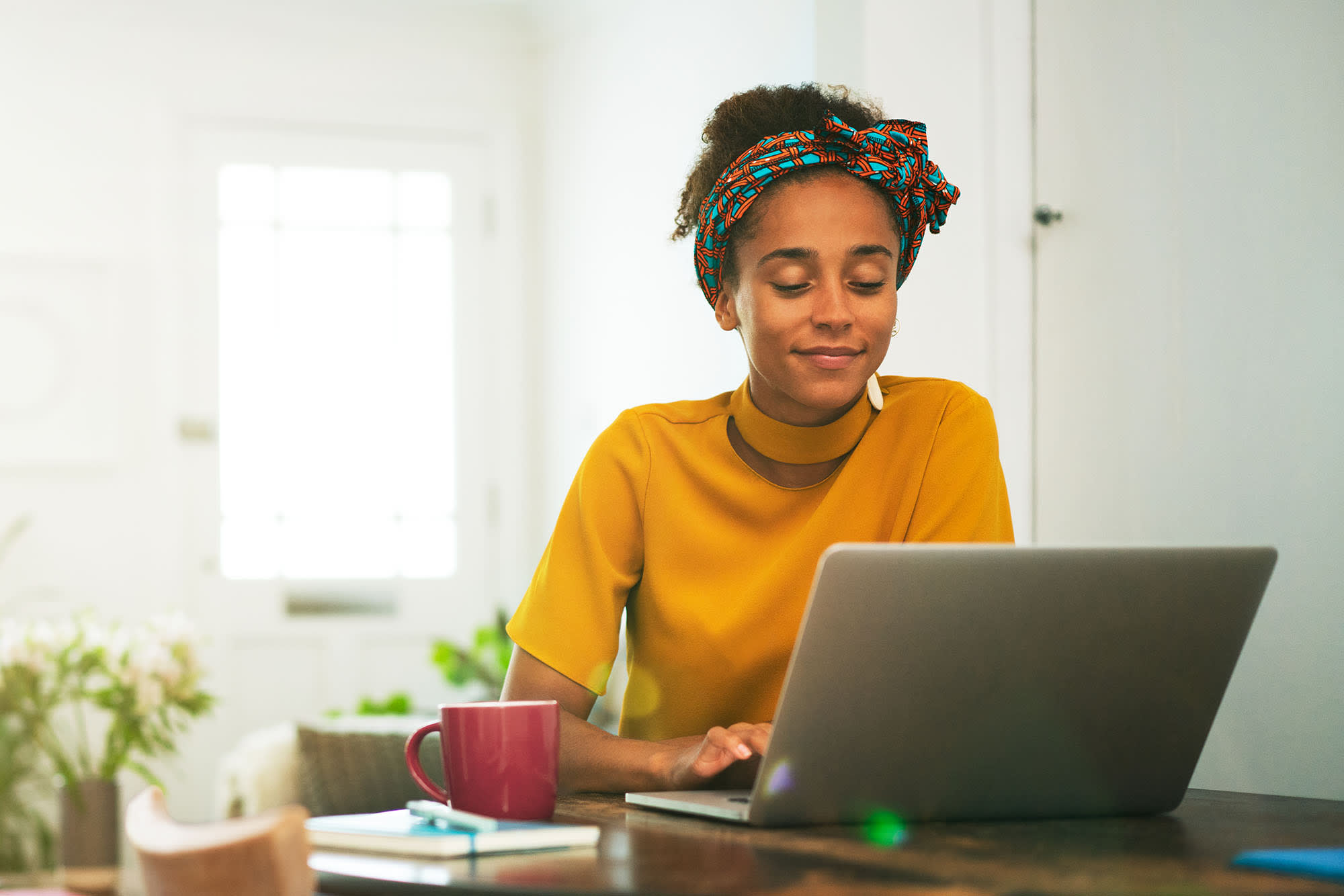 Woman using laptop in home