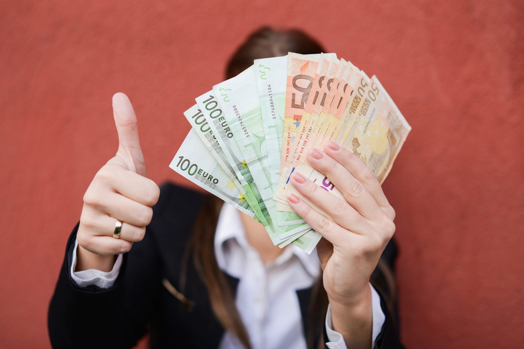 Woman holding Euro notes